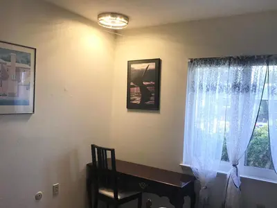 a room with a table and a window and a chair at Guest Suites in High Tech Park in Rancho Bernardo