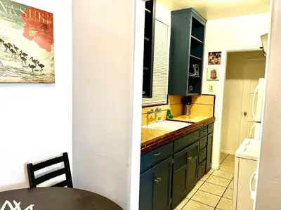 a kitchen with a sink and a counter top at Cozy Urban Cottage in San Diego