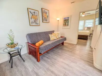 a living room with a couch and a table at Orange Grove Cottage in Bankers Hill in San Diego