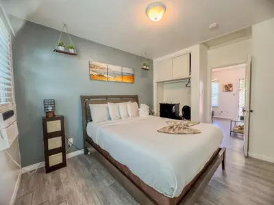 a bedroom with a large bed in a room at Amazing Cottage - near Little Italy Gaslamp in San Diego