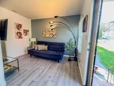 a living room with a couch and a table at Amazing Cottage - near Little Italy Gaslamp in San Diego