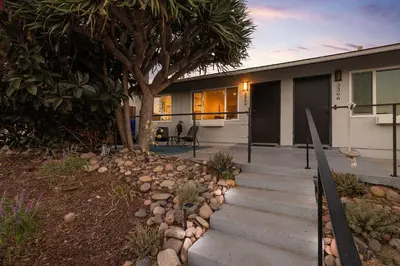 a house with a tree and some stairs in front of it at Central Location Balboa Park Villa in San Diego