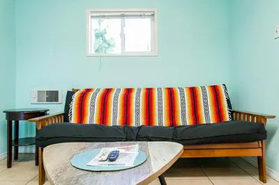 a couch with a colorful pillow on top of a table at Great Views Studio apartment near Little Italy in San Diego