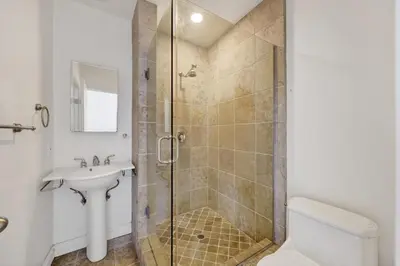 a bathroom with a shower and a sink and a toilet at Lovely Laguna Oceanside Gem! in Laguna Beach