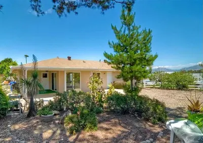 a house with a lot of plants in front of it at Guest Suite Northern San Diego Great Price in Rancho Bernardo