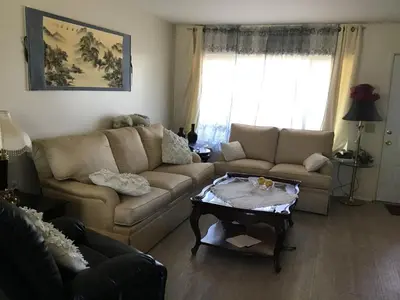 a living room with a couch and a coffee table at Guest Suite Northern San Diego Great Price in Rancho Bernardo