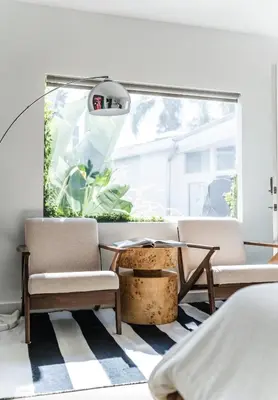a room with two chairs and a table and a window at Simple La Jolla Epic bungalow #1 in San Diego