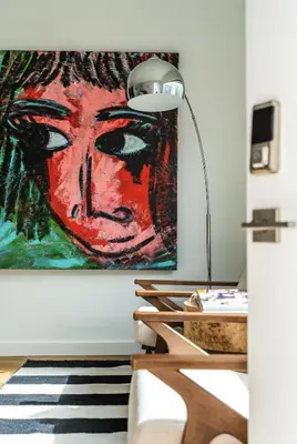 a room with a lamp and a painting on the wall at Simple La Jolla Epic bungalow #1 in San Diego