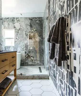 a bathroom with a shower with black and white tiles at Simple La Jolla Epic bungalow #1 in San Diego