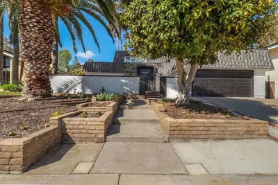 a walkway in a yard with trees and a house at Hey I Am Adriana On The Block Pool BBQ in Mission Viejo