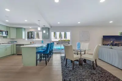 a kitchen and living room with a table and chairs at Hey I Am Adriana On The Block Pool BBQ in Mission Viejo