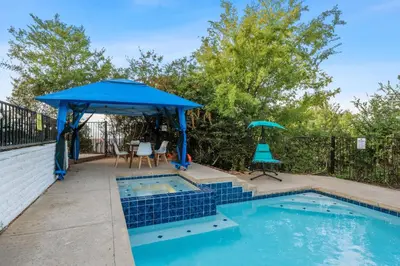 a pool with a blue umbrella and a table and chairs at Entire Private Home with 4 Bedrooms 3 Bathrooms, Big Yard, View, , King Bed, 10 Parking, Available Now in El Cajon