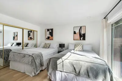 a bedroom with two beds and a window at Lux MV Home Live Like A Local Backyard Oasis in Mission Viejo