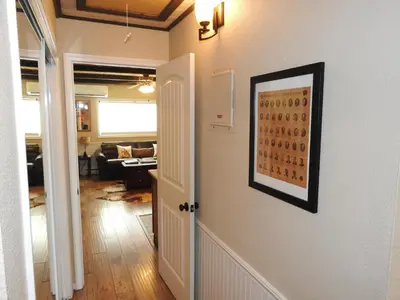 a hallway with a living room and a painting on a wall at Historic Gold Town Loft A-Frame 1 Bedroom with sofa sleeper WIFI in Julian