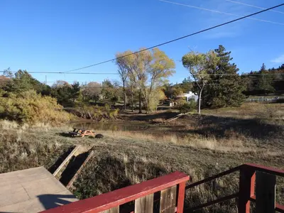 a view of a field from a wooden deck at Historic Gold Town Loft A-Frame 1 Bedroom with sofa sleeper WIFI in Julian