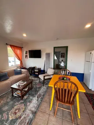 a living room with a couch and a table at The Sisters Casitas Frida & Violeta - 2 FULL APTS in San Diego