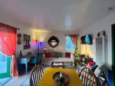 a living room with a couch and a table at The Sisters Casitas Frida & Violeta - 2 FULL APTS in San Diego