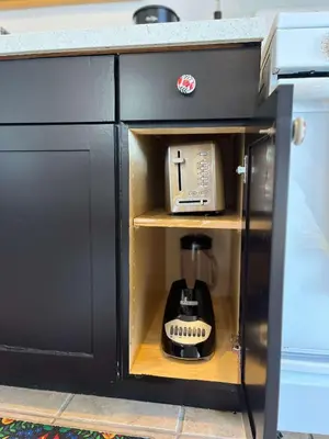 a kitchen cabinet with a coffee maker inside of it at The Sisters Casitas Frida & Violeta - 2 FULL APTS in San Diego