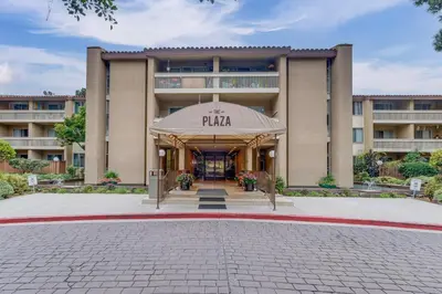 a building with the entrance to the plaza at 1 Mi to PB Boardwalk Condo with Community Perks in San Diego