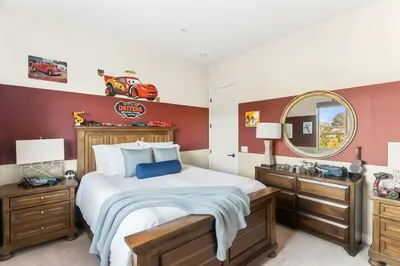 a bedroom with a large bed and a mirror at Vineyard Vista Retreat in Temecula