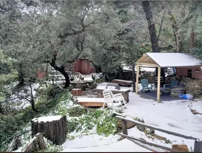 a gazebo in the snow in a yard at Cozy Cabin Hot Tub Sauna Fireplace in Palomar Mountain