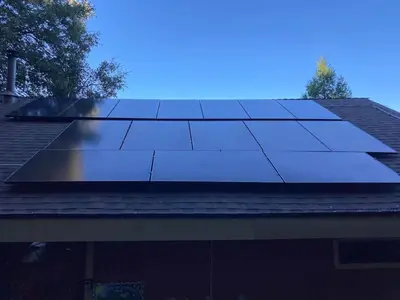 a group of solar panels on top of a roof at Cozy Cabin Hot Tub Sauna Fireplace in Palomar Mountain