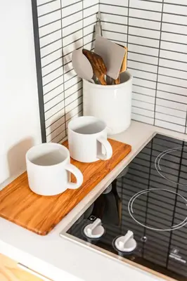 two cups on a cutting board on a kitchen counter at Simple La Jolla Epic bungalow # 2 in San Diego