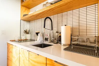 a kitchen with a sink and a counter top at Simple La Jolla Epic bungalow # 2 in San Diego