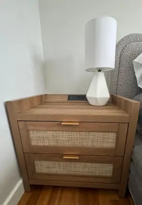 a bedside table with a lamp on top of it at Amazing La Jolla Ocean View 2 bedroom apartment in San Diego
