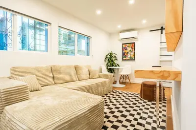 a living room with a couch and a table at Simple La Jolla 2 bedroom - Alley Unit in San Diego