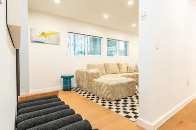 a living room with a couch and a table at Simple La Jolla 2 bedroom - Alley Unit in San Diego