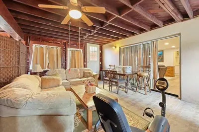 a living room with a couch and a table at Private Spacious Full Bed Studio in San Diego