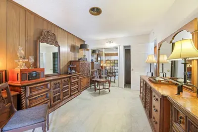 a large kitchen with wooden cabinets and a mirror at A Visit to Grandma's House in San Diego