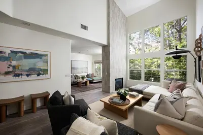 a living room with a couch and a table at Newport Coast Bungalow in Newport Beach