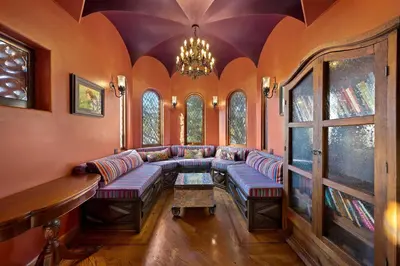 a living room with couches and a chandelier at Skyline and Bay Views Spanish Villa Pool and Hot Tub in San Diego