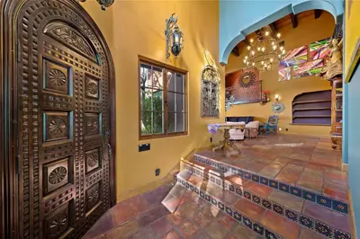 a room with a large wooden door in a house at Skyline and Bay Views Spanish Villa Pool and Hot Tub in San Diego