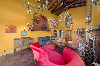 a living room with a red couch and chairs at Skyline and Bay Views Spanish Villa Pool and Hot Tub in San Diego