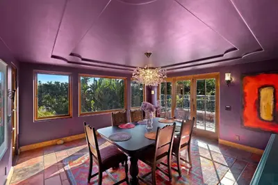 a purple dining room with a table and chairs at Skyline and Bay Views Spanish Villa Pool and Hot Tub in San Diego