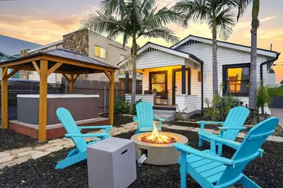 two blue chairs and a fire pit in front of a house at Mid-City 2BR Retreat Firepit Nights with Free Parking in San Diego