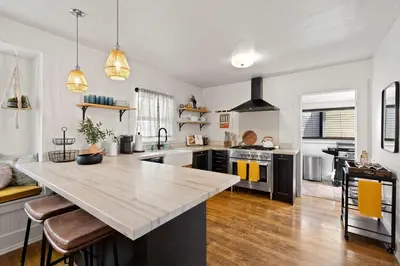 a kitchen with a large island in the middle at Mid-City 2BR Retreat Firepit Nights with Free Parking in San Diego