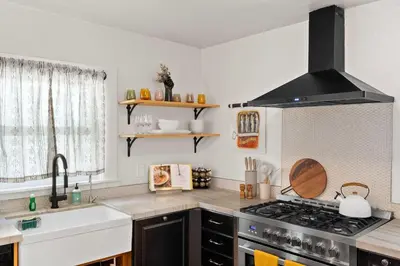 a kitchen with a stove and a sink at Mid-City 2BR Retreat Firepit Nights with Free Parking in San Diego