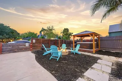 a patio with blue chairs and a gazebo at Mid-City 2BR Retreat Firepit Nights with Free Parking in San Diego