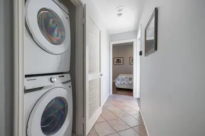 a laundry room with a washer and dryer at Surfing SapphirePrivate Rooftop Hot Tub wFirepit in San Diego