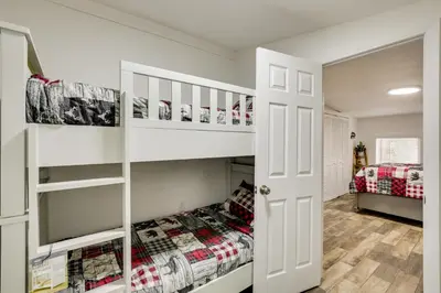 a white bunk bed in a bedroom with a bed in a room at Modern Backcountry Retreat! Bike and Hike Mt Laguna in Mount Laguna