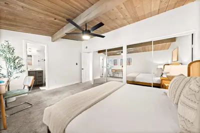 a bedroom with a bed and a ceiling fan at Spacious 4BR Retreat with Hot Tub Fire Pit and Patio in San Diego