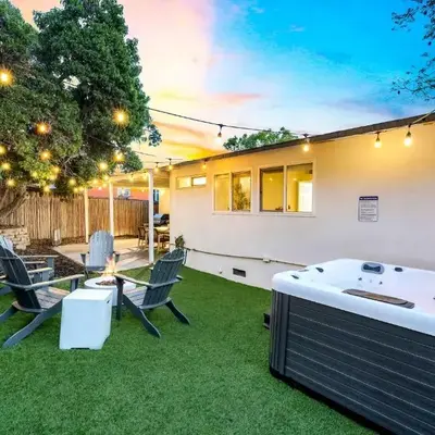 Spacious 4BR Retreat with Hot Tub Fire Pit and Patio