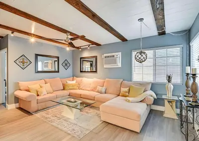 a living room with a couch and a table at Spacious Family Getaway with Grill Firepit and Patio in San Diego