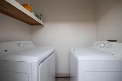 a laundry room with a washer and dryer at Walk to beach Prime location Villa in San Diego