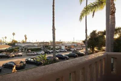 a view from a balcony of a parking lot with cars at Walk to beach Prime location Villa in San Diego