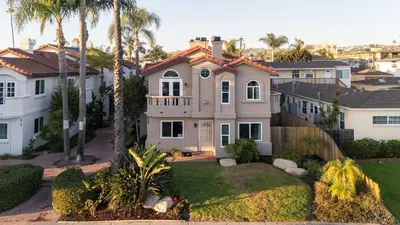an aerial view of a house with palm trees at Walk to beach Prime location Villa in San Diego